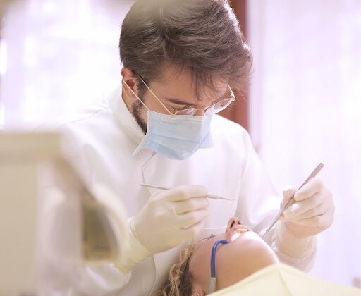 dental anxiety page showcasing doctor doing dental procedure on patient 