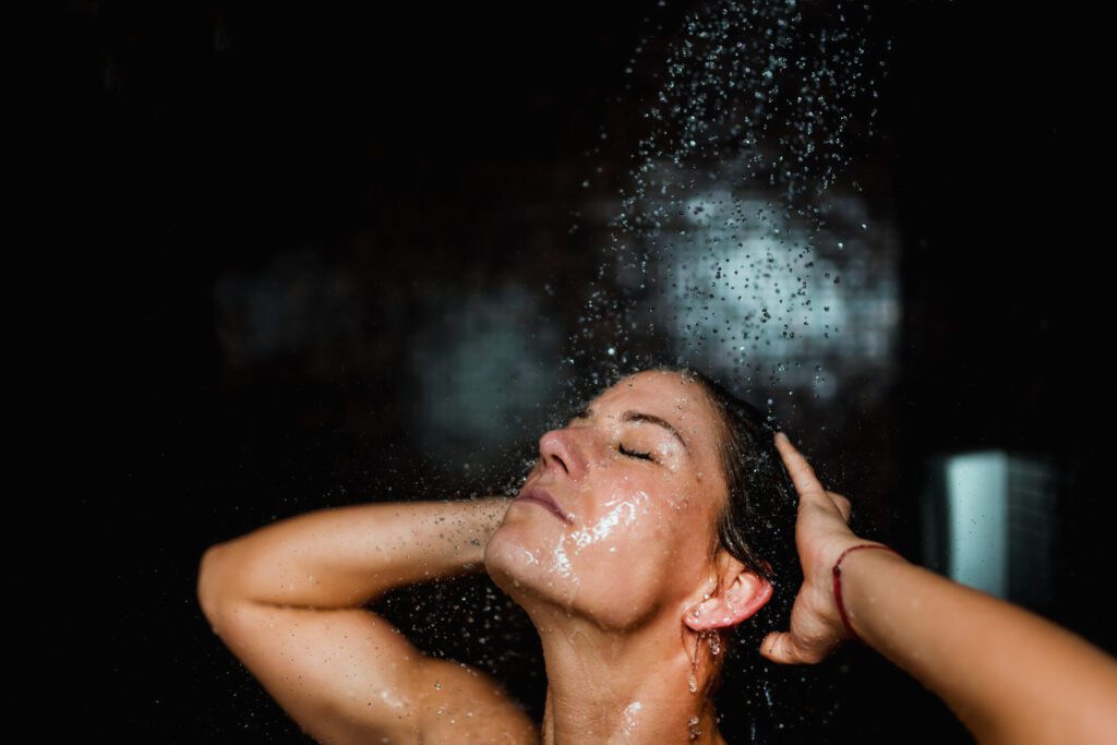 Beautiful Woman Taking a Shower with Fluoride Free Water